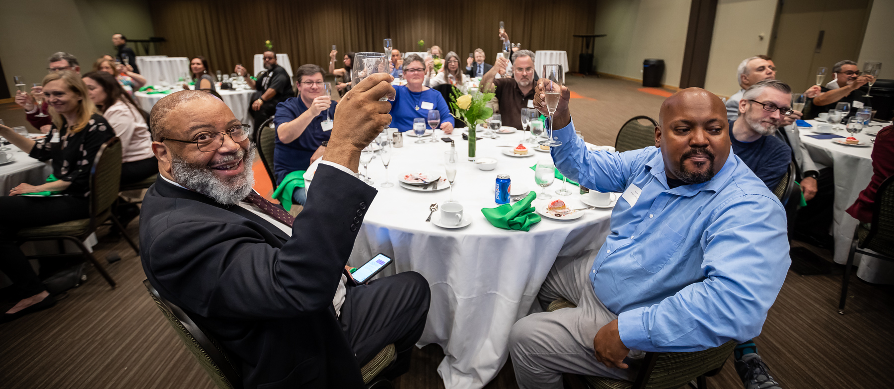 Attendees raise their glasses for a toast during the first in-person Distinguished Service Awards luncheon since 2019.